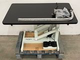 an image of a table with a black table top and a black table top