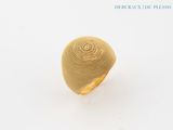 gold plated ring with a circular design on the center