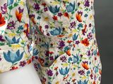 a close up of a mannequin mannequin wearing a floral dress