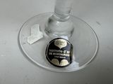 a wine glass with a bottle of wine in it