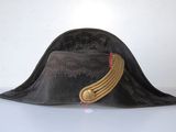 a black hat with a gold band on it