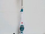 a mop that is sitting on a table next to other items