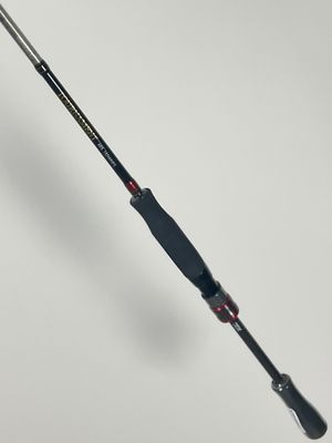 a close up of a fishing rod on a white surface