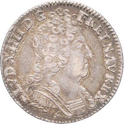 une pièce d'argent portant une tête de femme