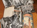 several old postcards of different cities and buildings on a table