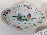 two plates with different designs on them sitting on a table