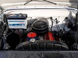 a car engine with the hood up and the hood down