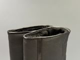 a close up of a pair of black boots on a white background