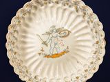 an image of a plate with a picture of a boy on it