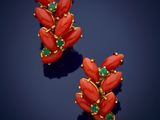 a pair of coral and emerald earrings