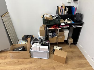 a pile of boxes and boxes on the floor in a room