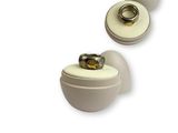 pair of white ceramic knobs with a gold ring on each of them
