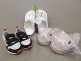 two pairs of shoes and a stuffed animal on the floor