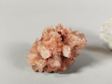a small cluster of crystals sitting next to a larger one