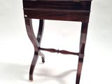 a small wooden table with a drawer on top of it