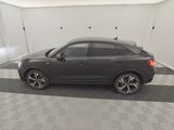 a picture of a car in a garage with a checkered floor