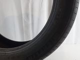 a close up of a tire on a white surface with a white background