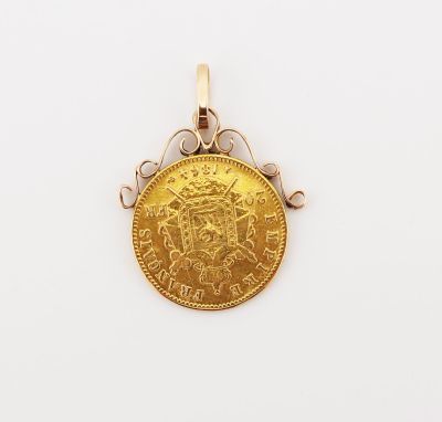 a close up of a gold coin on a white surface