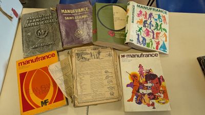 many books that are sitting on a table