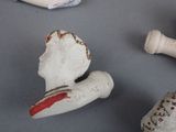 three figurines that are sitting on a table