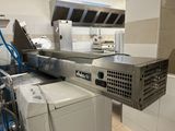 an image of a commercial kitchen with a washer and dryer