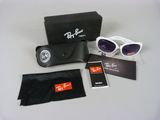 ray bans sunglasses and cleaning cloth are on a table