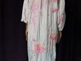 an image of a mannequin dressed in a white and pink dress