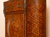 a wooden cabinet with a drawer on top of it