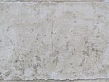 a stone plaque with a boat on it on a wall