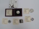 a silver coin with a wooden case on a table