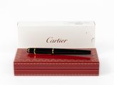 the pen is sitting on top of a red box with a white box in the background