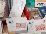 many cards and envelopes on the counter of a store