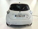 a picture of a white car with a license plate