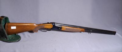 an old rifle with a wooden barrel and a leather case