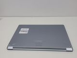 a laptop that is sitting on a white table
