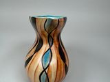 a small vase that is sitting on a table