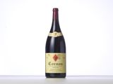 a bottle of red wine sitting on top of a table
