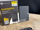 a box and a mouse on a table next to it