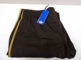 brown and yellow adidas shorts with a blue tag on the side