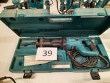 a blue box with tools in it on a table