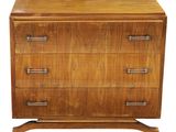 a wooden chest of drawers on a white background