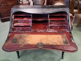 an old desk with a lot of drawers on it