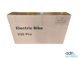 a cardboard box with an electronic bike in it