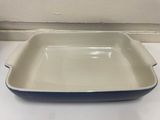 a blue and white dish sitting on a counter