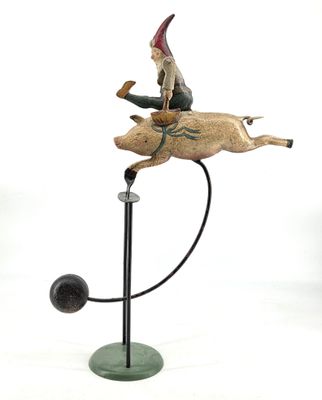 statue of a man riding a horse with a dog on it