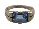 an image of a ring with a blue stone in it