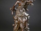 an image of a bronze statue of a woman on a horse