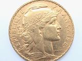 a close up of a gold coin with a woman ' s head on it