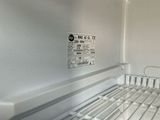 an empty refrigerator with a lot of food inside of it