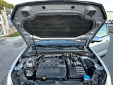 a car with its hood open and the engine in the trunk